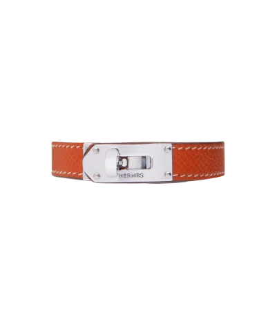 奢侈品牌爱马仕（Hermès）钢制搭配橙色皮革手链。在 VIRTU LUXURY 有售。